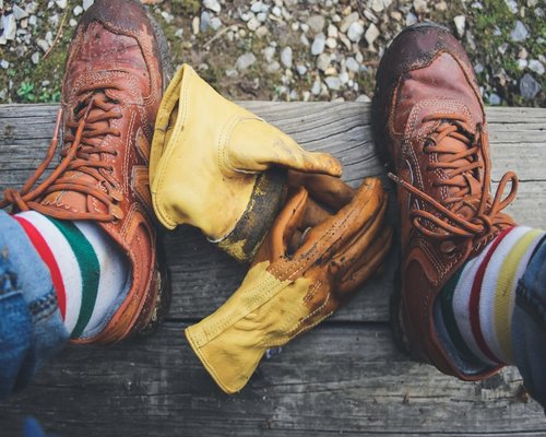 A pair of comfortable leather shoes resting next to folded cotton socks